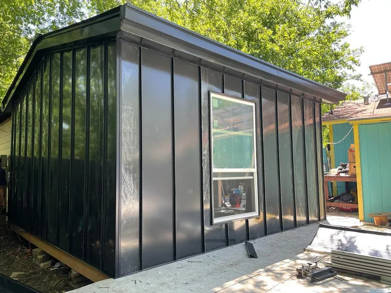 Black standing seam metal wall panels for Roof Inspection in Scott